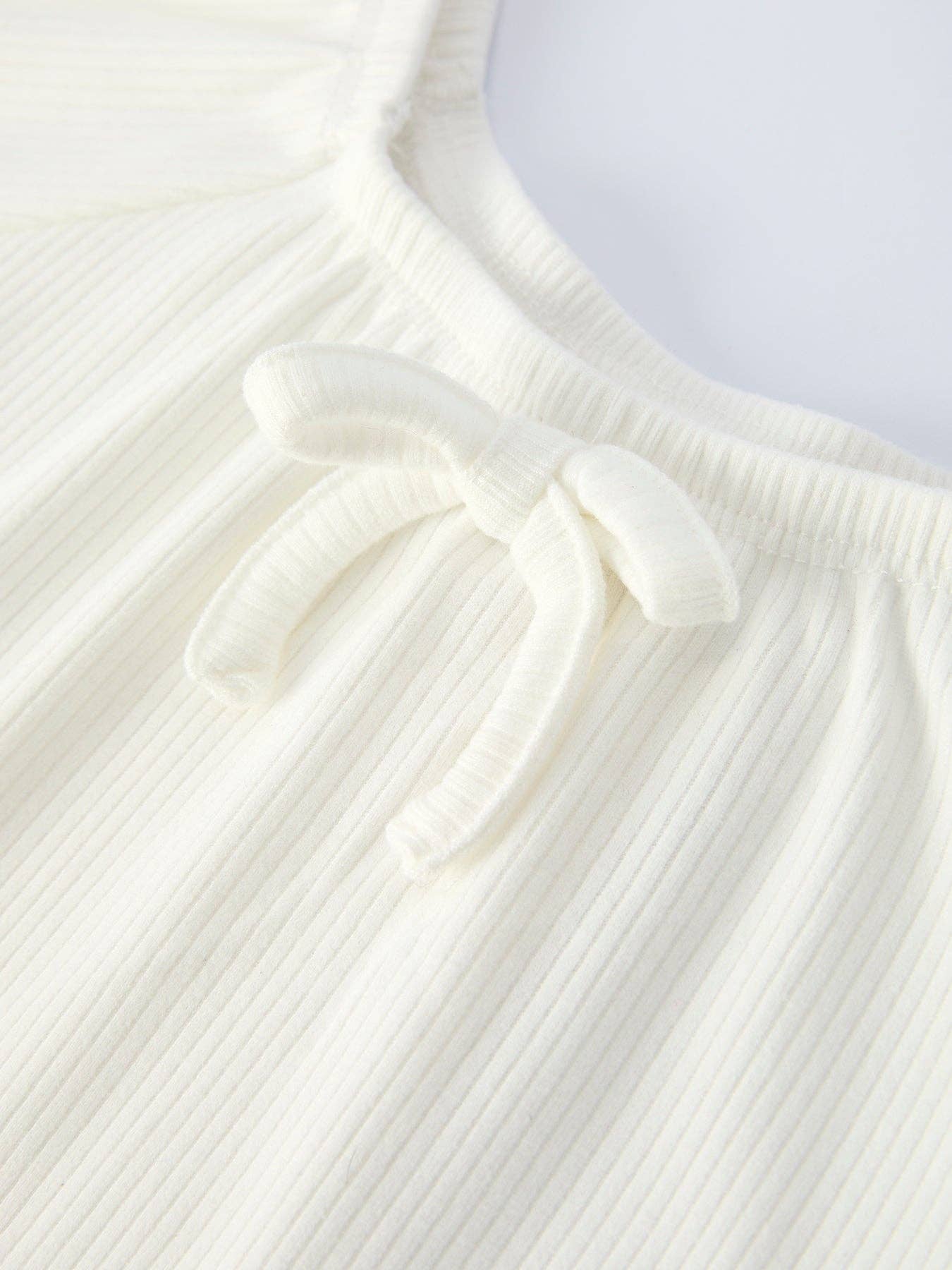 White Top And Daisy Flared Pants Outfit