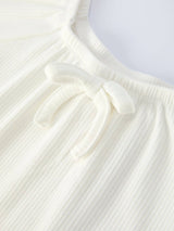 White Top And Daisy Flared Pants Outfit