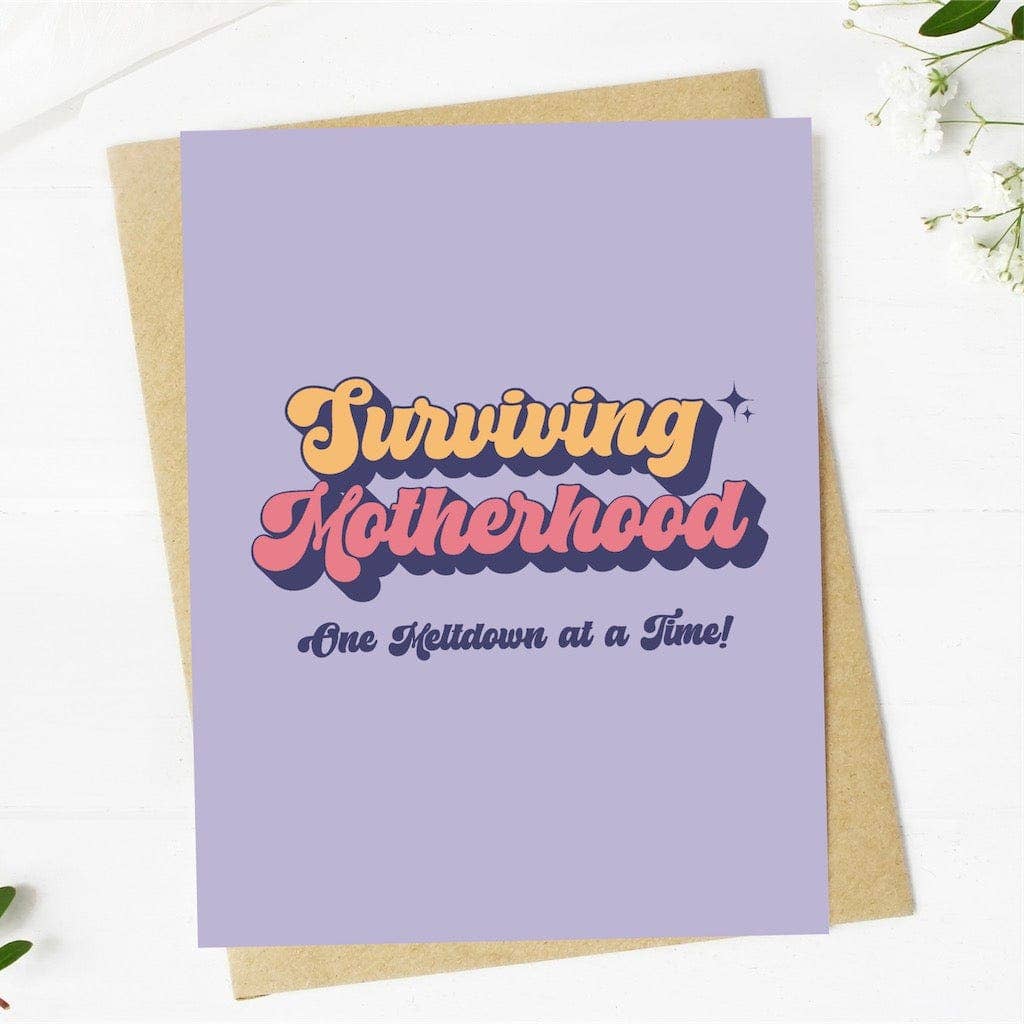"Surviving motherhood one meltdown at a time" lettering card